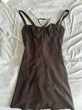 Black corset-style dress with lace up details